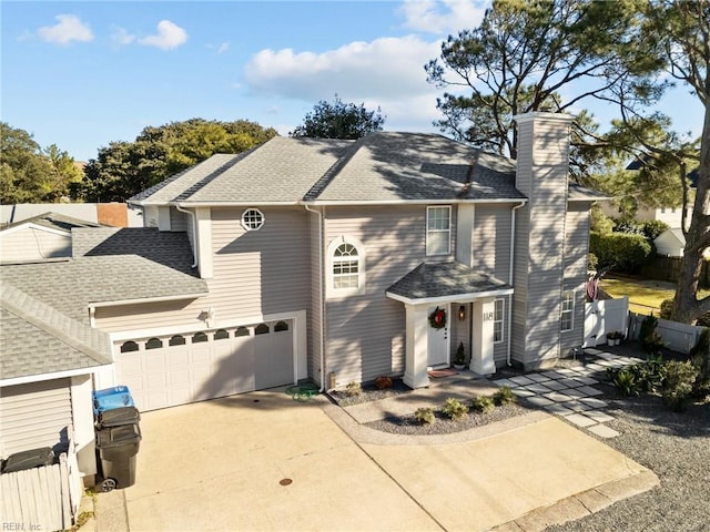 view of front of property with a garage