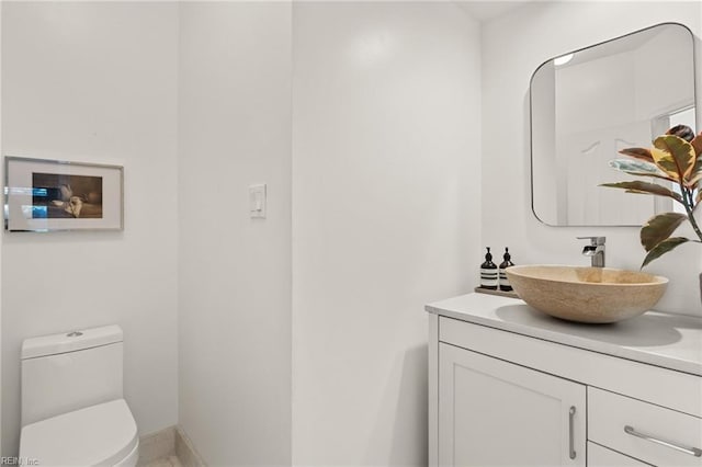 bathroom with vanity and toilet