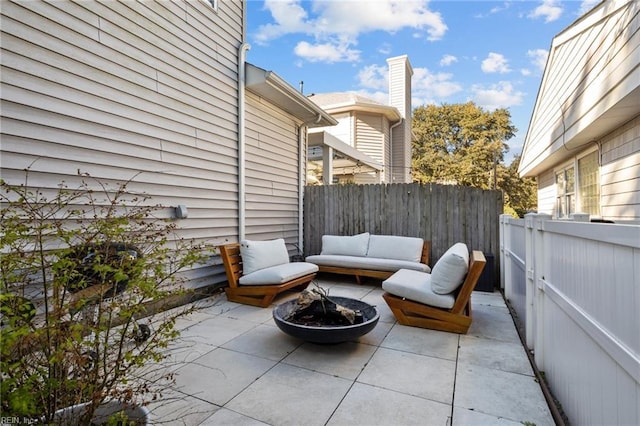 view of patio with a fire pit