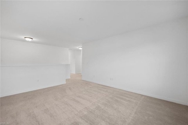 spare room with light colored carpet