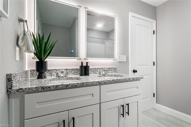 bathroom with vanity and walk in shower