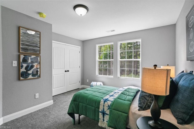 bedroom featuring carpet and a closet