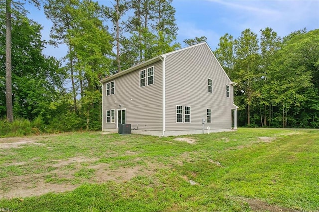 view of home's exterior featuring a lawn and central air condition unit