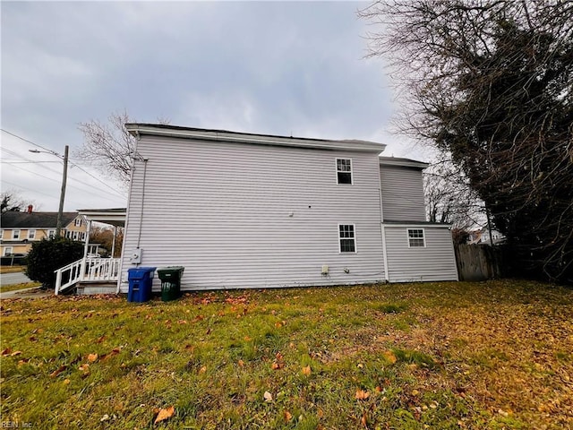 view of home's exterior with a lawn