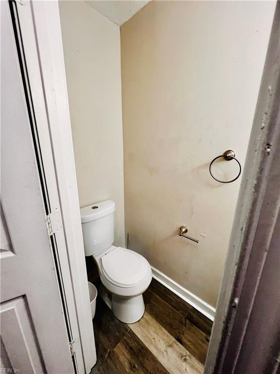 bathroom featuring hardwood / wood-style floors and toilet