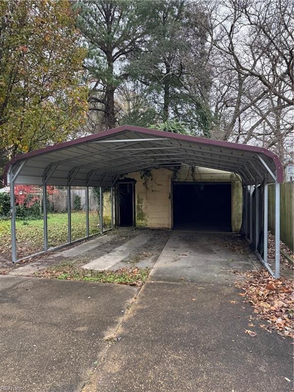 view of parking / parking lot with a garage and a carport