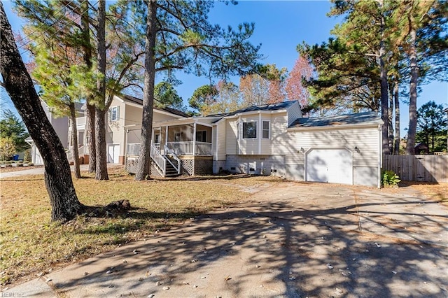 view of front of property featuring a porch and a garage