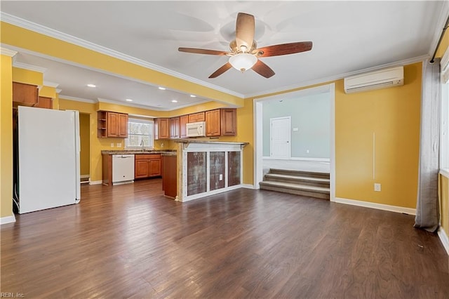 kitchen featuring ceiling fan, dark hardwood / wood-style flooring, an AC wall unit, crown molding, and white appliances