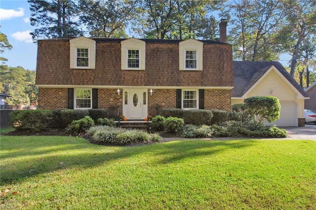 new england style home with a front lawn