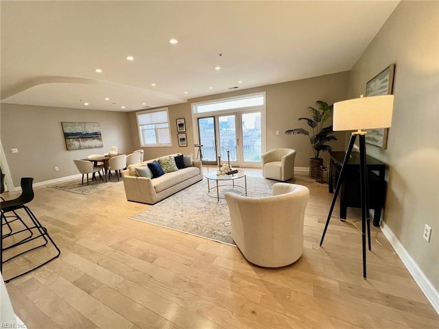 living room with light hardwood / wood-style floors