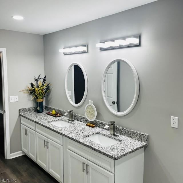 bathroom featuring vanity and wood-type flooring