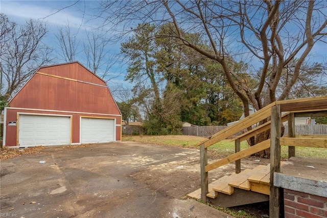 exterior space featuring an outbuilding and a garage