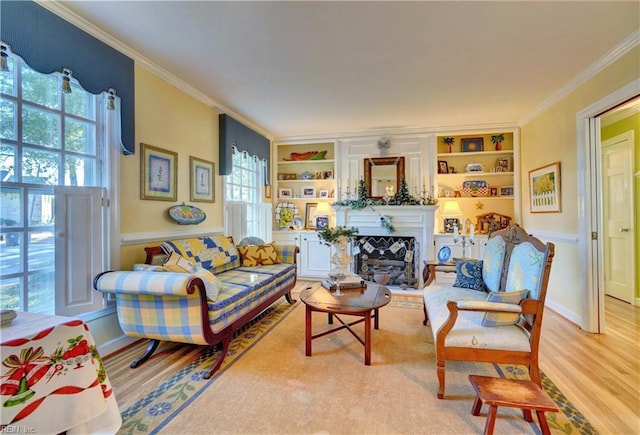 living room featuring plenty of natural light, light hardwood / wood-style floors, and ornamental molding