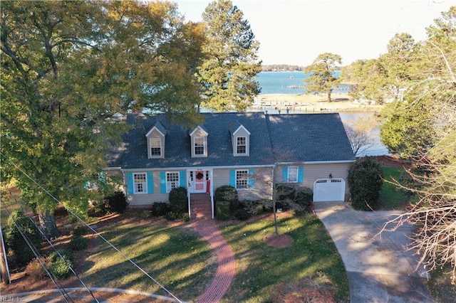 cape cod home featuring a water view and a garage