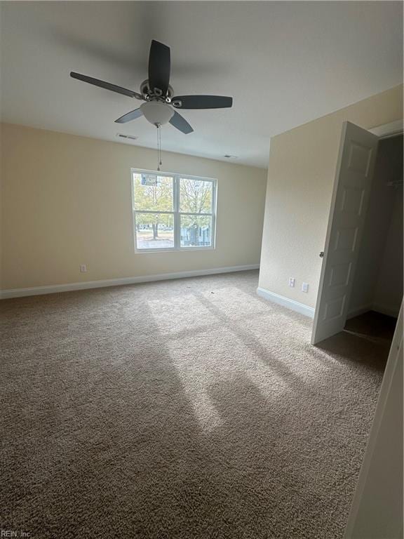 unfurnished room featuring carpet flooring and ceiling fan