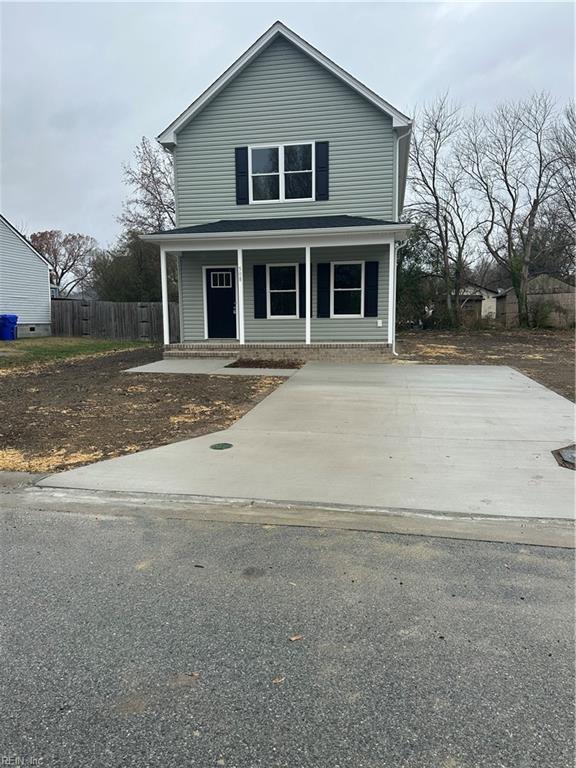 view of property featuring covered porch