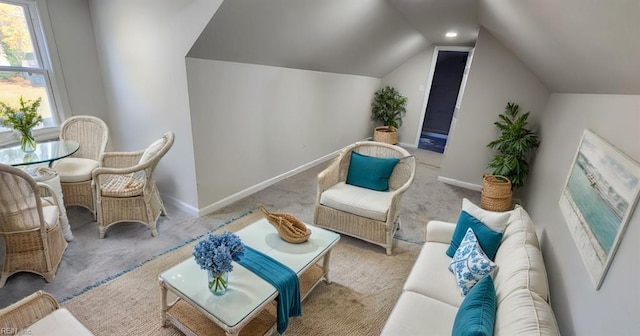 living room with light carpet and vaulted ceiling