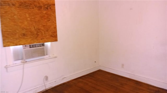 spare room featuring dark hardwood / wood-style flooring