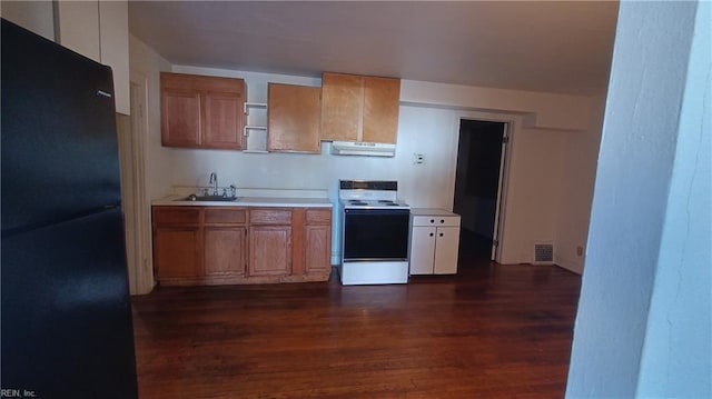 kitchen featuring dark hardwood / wood-style flooring, sink, black refrigerator, and white electric range