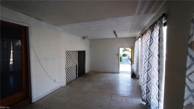 interior space featuring a textured ceiling