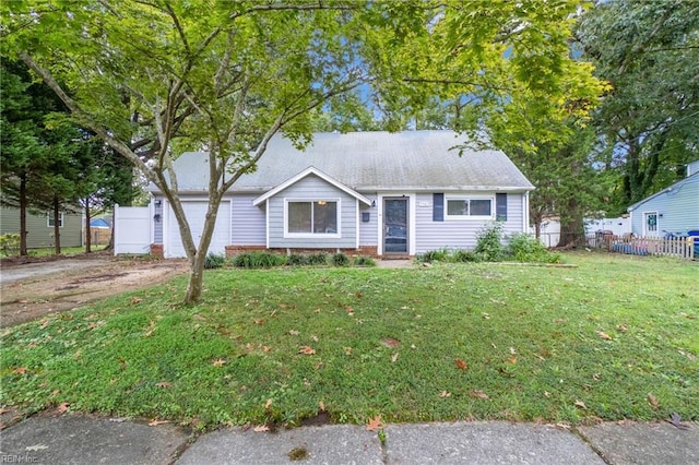 view of front facade with a garage and a front yard