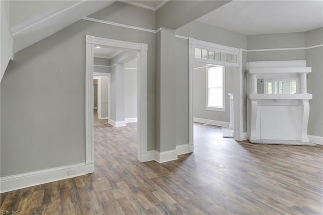 interior space with wood-type flooring and ornamental molding