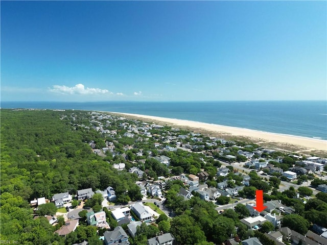 drone / aerial view featuring a view of the beach and a water view