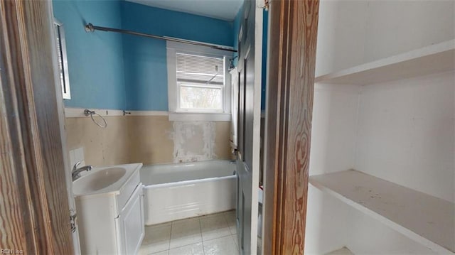 bathroom with tile patterned flooring and vanity