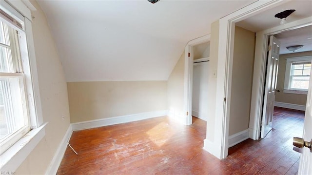 bonus room featuring lofted ceiling and dark wood-type flooring