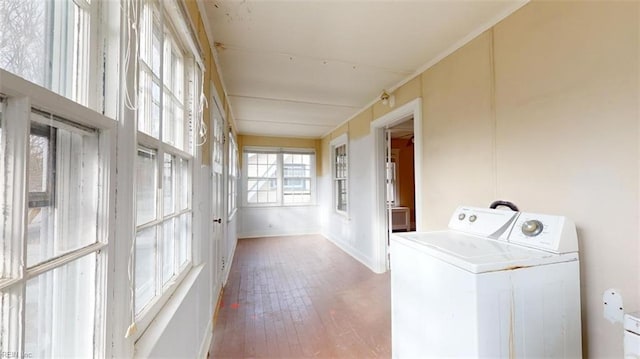 laundry area featuring hardwood / wood-style flooring and washer / clothes dryer