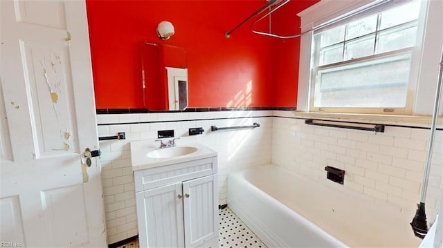 bathroom featuring vanity and tile walls