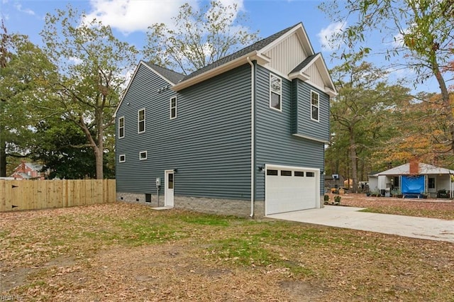 view of property exterior featuring a garage