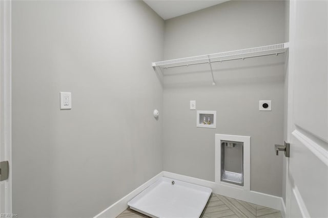 washroom with washer hookup and hookup for an electric dryer