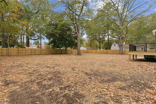 view of yard with a wooden deck