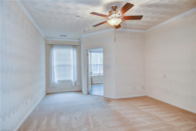 unfurnished room featuring light carpet, crown molding, and ceiling fan