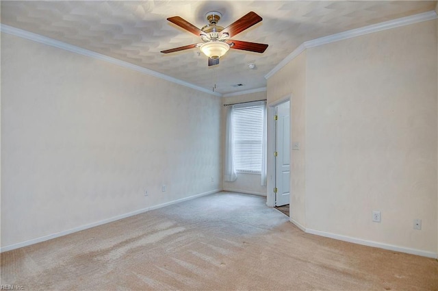 carpeted empty room featuring ceiling fan and ornamental molding