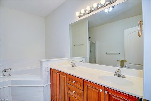 bathroom with vanity and separate shower and tub