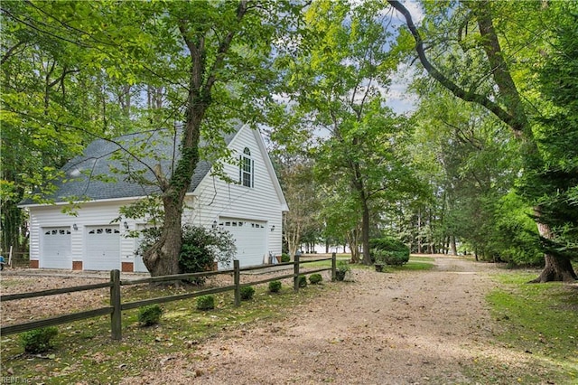 view of side of property featuring a garage