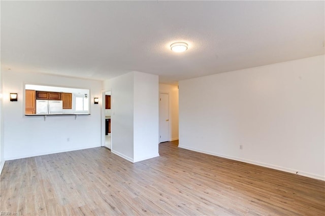 unfurnished living room with light hardwood / wood-style floors