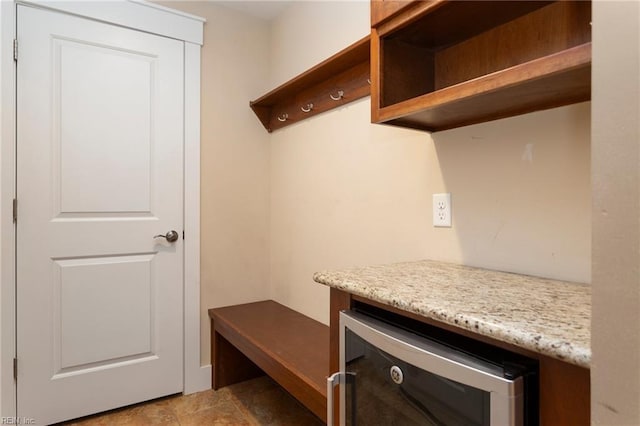 mudroom featuring wine cooler