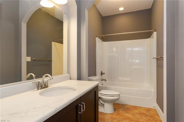 full bathroom featuring vanity, toilet, and washtub / shower combination