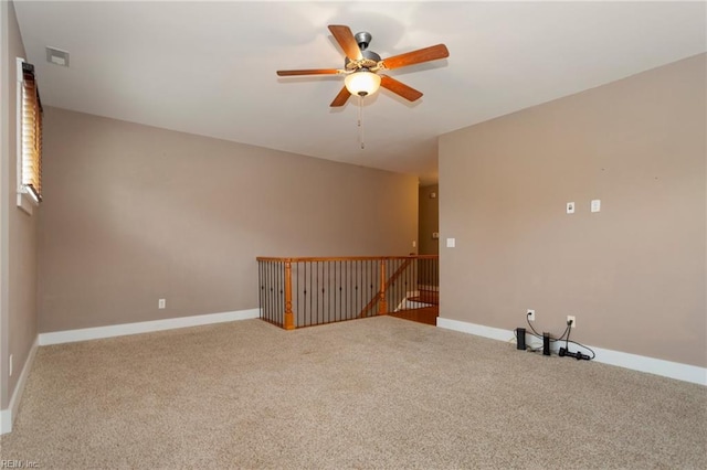 spare room with carpet flooring and ceiling fan