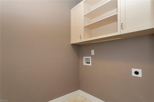 clothes washing area featuring hookup for a washing machine, light tile patterned flooring, cabinets, and hookup for an electric dryer