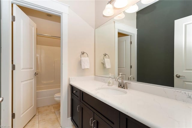 full bathroom featuring tile patterned floors, vanity, toilet, and shower / tub combination