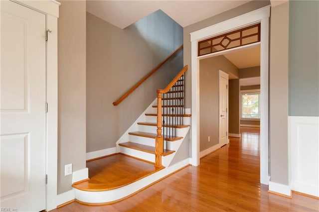 stairs featuring hardwood / wood-style flooring