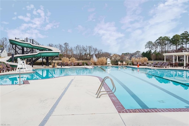 view of pool with a water slide