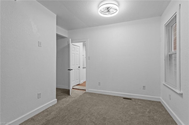 unfurnished bedroom featuring carpet