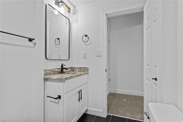 bathroom with tile patterned flooring and vanity