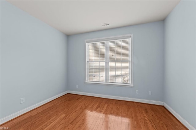 unfurnished room with light hardwood / wood-style floors