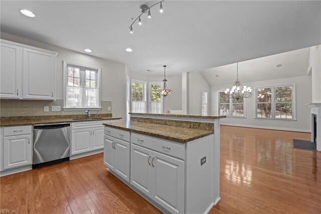 4756 Winterberry Ct, Williamsburg, VA 23188 - kitchen with dishwasher, light wood-style flooring, a kitchen island, healthy amount of natural light, and recessed lighting